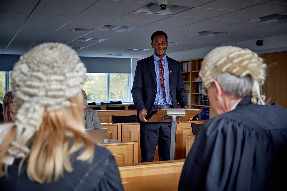 A law student at Keele University in the moot courtroom.